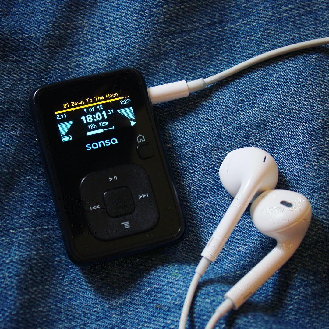 SanDisk Sansa Clip MP3 player with earphones